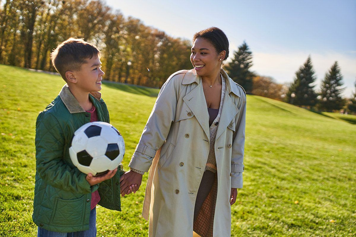 A mother with her soccer-playing son.