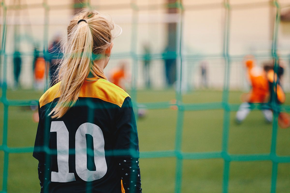Young female soccer player on the field.